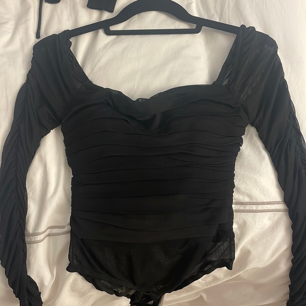 Ruffly long sleeve bodysuit